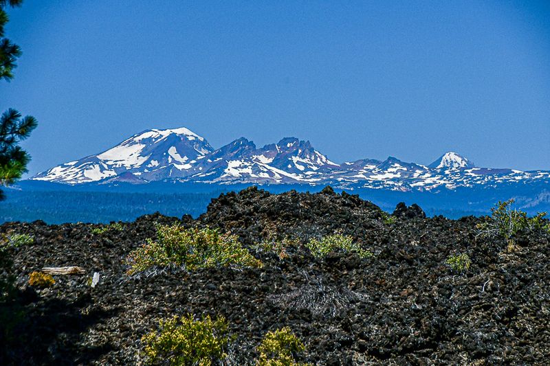 07 19 Lava Butte lava flow (image lower half); South Sister Mt. (L); Broken Top Mt. (R); Middle Sister Mt. 7904