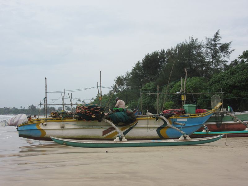 A fisherman mending his nets