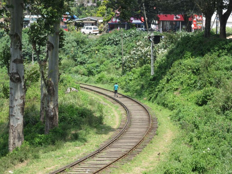 Locals walk along the trainline - easier than the road