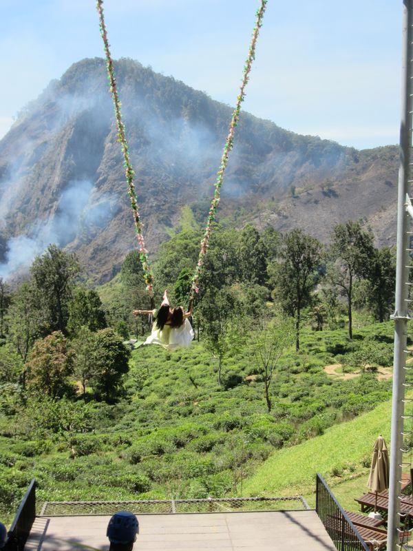 Girls with flowing dresses on a swing (it's a thing)