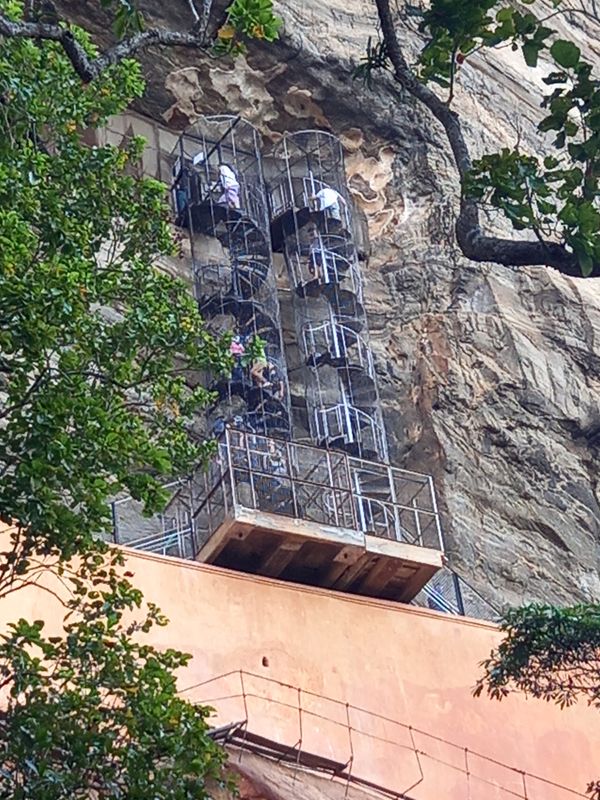 These go up and down to frescoes decorating the rock face