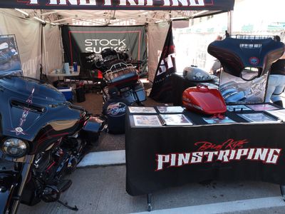This Guy Was Doing Pinstriping Right There In The Tent....