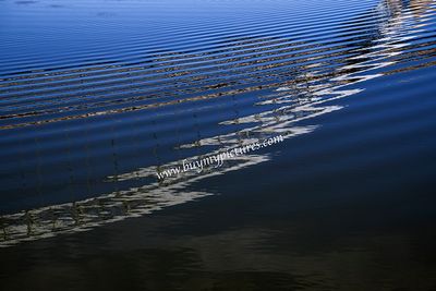 Reflections of a bridge on a water surface