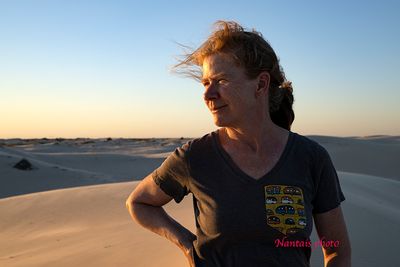 A woman looking at the sunset in the Texas desert
