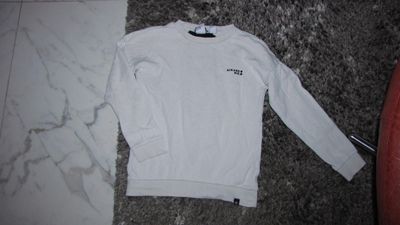 140 NIK & NIK sweater offwhite met leuke achterkant 16,50