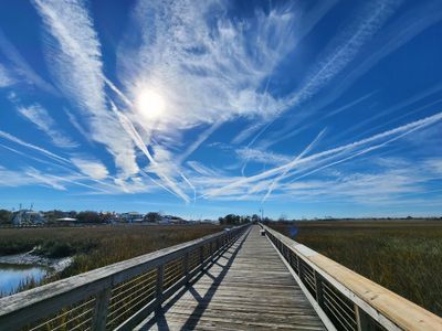 20240110_132346 Contrails and Shem Creek Boardwalk.jpg