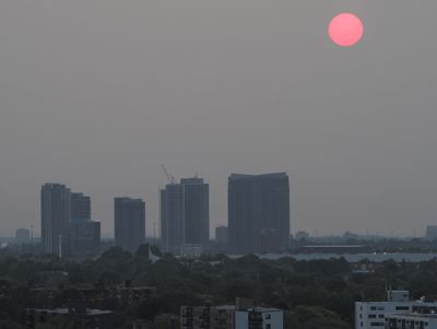 Toronto fire smoke attenuated sunrise.jpg