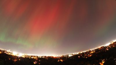 Aurora over city through a fisheye.jpg