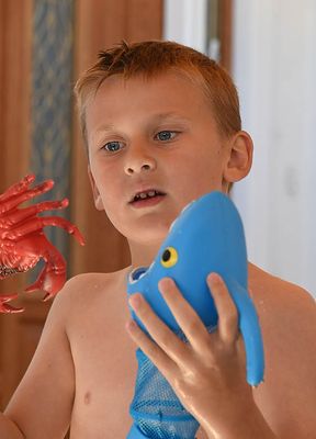 With His Shark and Crab