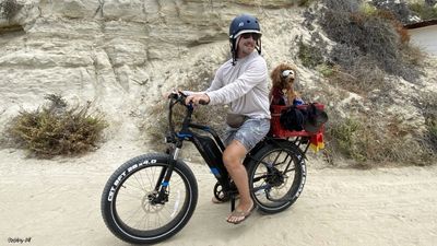 Beach biking couple