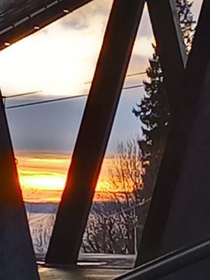 sunset through the ski structure