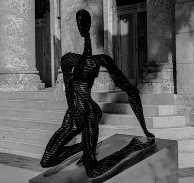 Metal sculpture  -kneeling nude-
