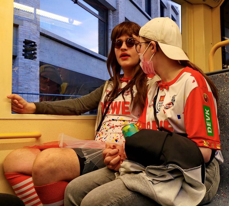 Koln: carnival people; the guy is disguised on girl and ... vive-versa.