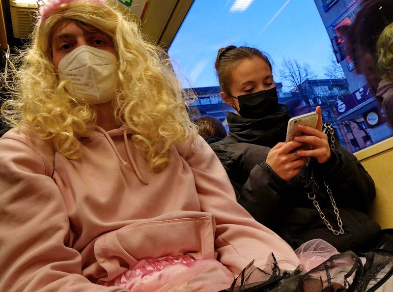 Koln: carnival people in the tramway