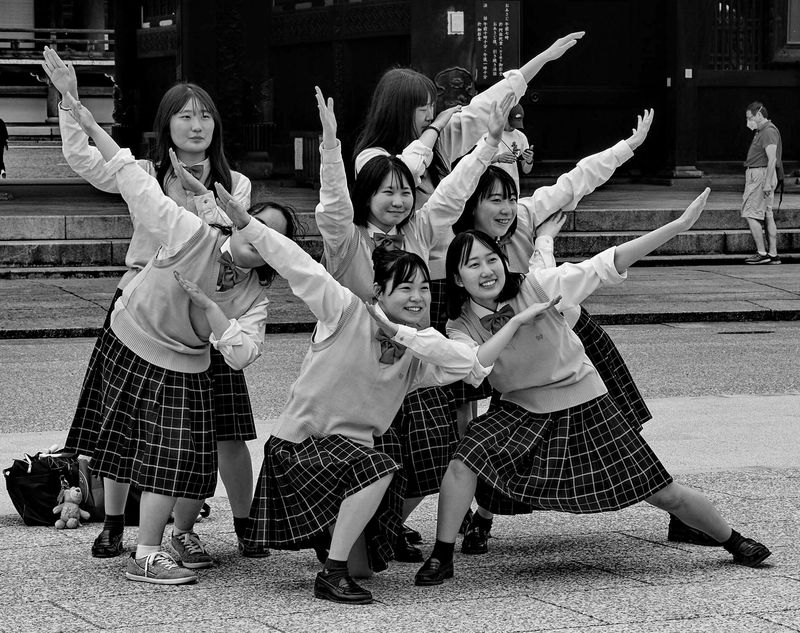 Kyoto; students playing in front of the Higashi-Honganji Temple.
