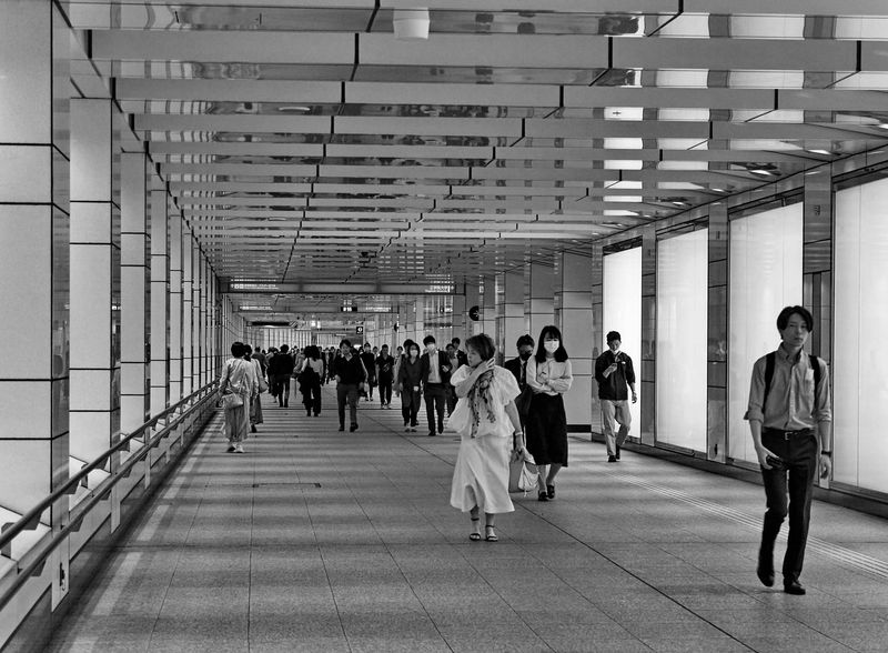 Near the station; people going to work.