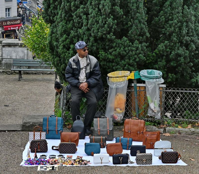Buy a nice, fake and not expensive bag; near the Basilique Sacr Coeur.