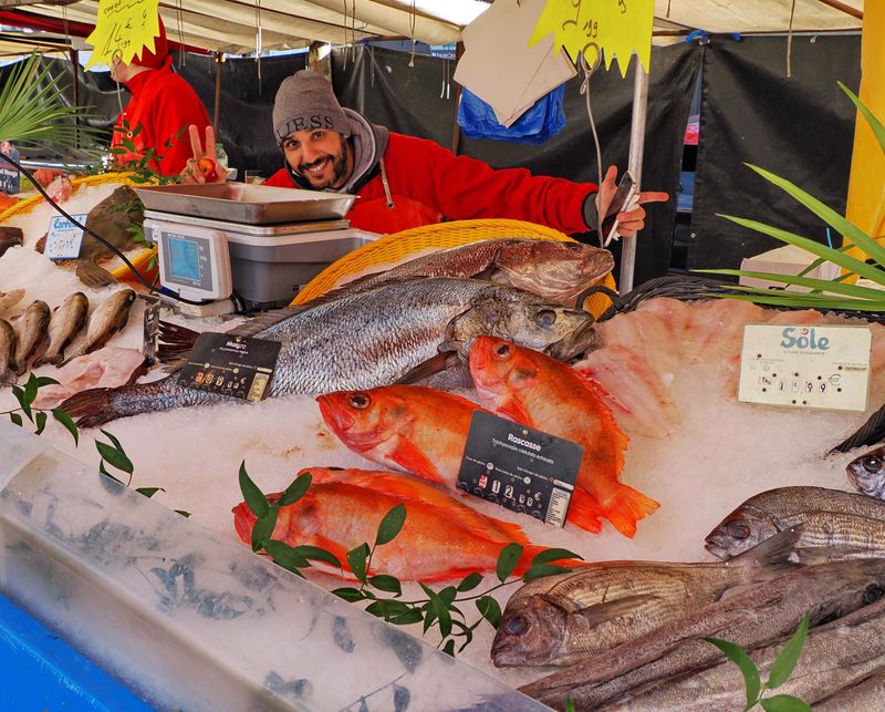 The smiling guy and the rouget fish.
