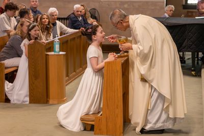 Johanna receiving her first communion