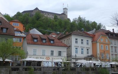Slovenian House and other restaurants with castle above