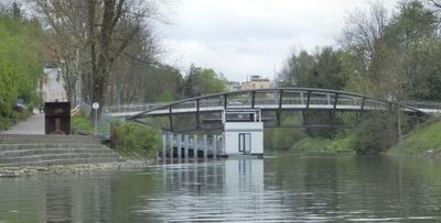 Vladotova footbridge over South East loop of Ljubljanica near Spica Park