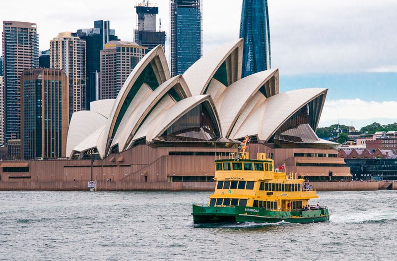 Sydney Harbour ferry 'Borrowdale' passing the Sydney Opera House, NSW