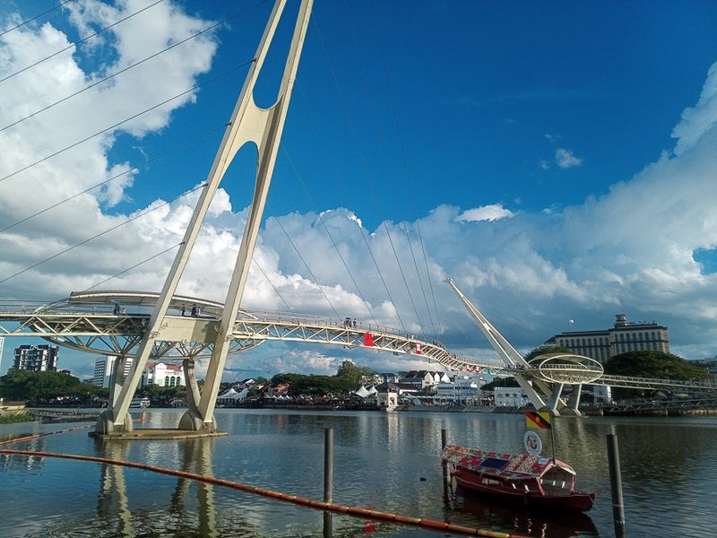 Futuristic footbridge spans the Sarawak River at Kuching. 