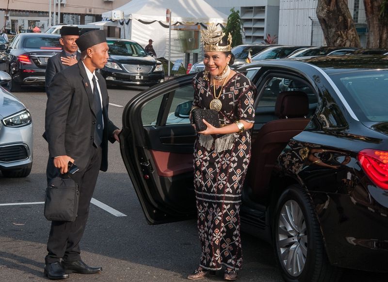 A VIP woman wearing traditional dress arrives for the Sultans 77th Birthday festivities, Brunei