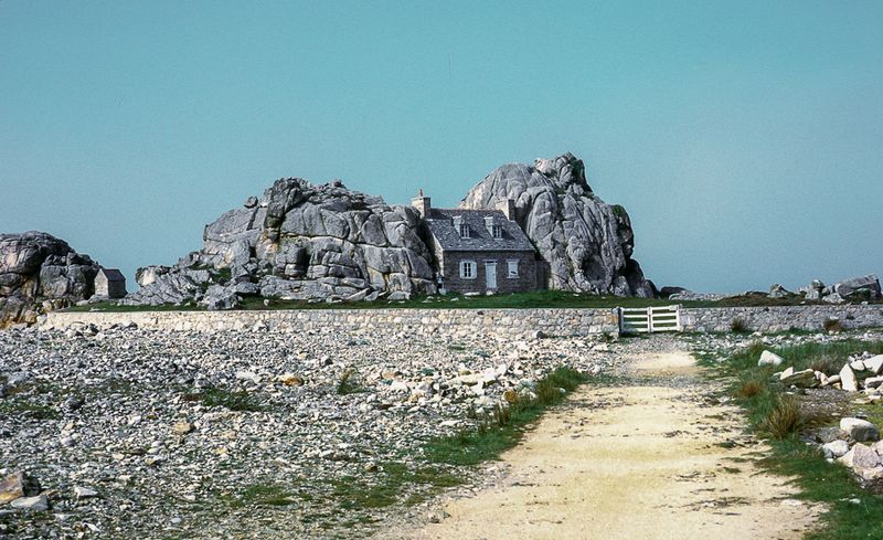 Breton cottage nestled between granite tors, Plougrescant, France
