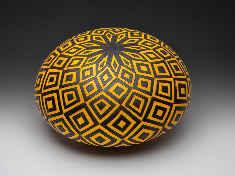 Made from Yellow Cedar. 7.5 h x 14 dia. and decorated. (bottom view)