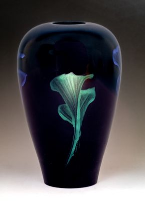 Hollow turned vessel with iridescent paint.