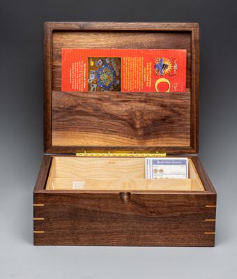 Walnut box to hold 'Settlers of Catan' game with lid up.