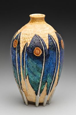 White Pine hollow turned vase with feathers carved and painted.