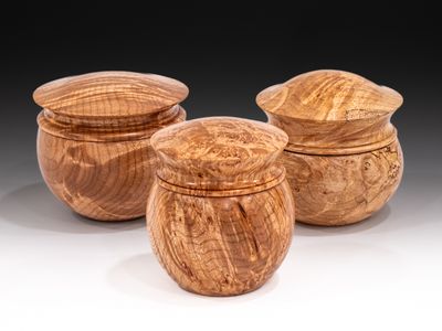 Lidded boxes made from Big Leaf Maple burl.