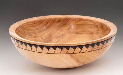 Fruitwood bowl with decorated rim.