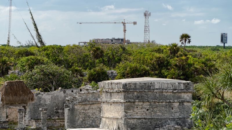 Tulum Ruins with an ever growing city of Tulum in the background