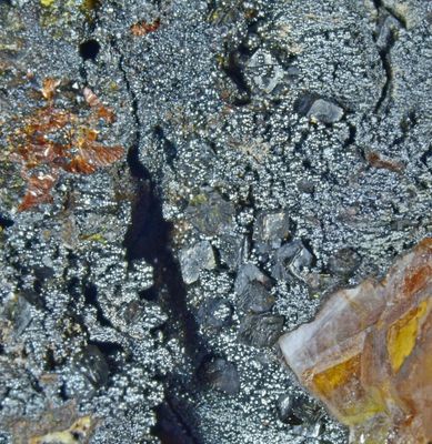 Corkite crystals to about 1 mm on limonite, Roughton Gill, Caldbeck Fells, Cumbria