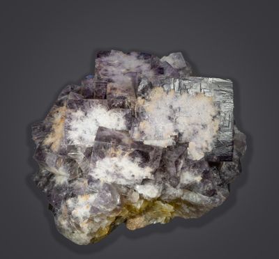 Purple fluorite crystals, to 4 cm in 8 cm group, from the recent mining activities at Greenlaws Mine, Daddry Shield, Weardale.