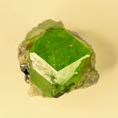 Tsavorite crystal, 15 mm, Merelani Hills, showing tetrahexhedron face
