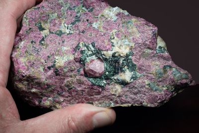 Eudialyte with 15 mm complete crystal in the centre