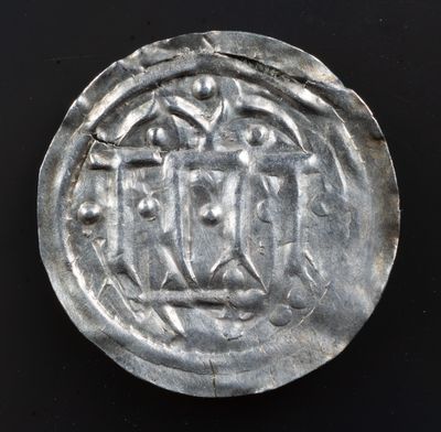 Early Danish semibracteate, 10th century, thought to be Hedeby mint. Hauberg 1, KG9, after Carolingian Dorestat denier