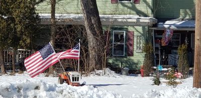 This home was all decked out with flags in the middle of winter
