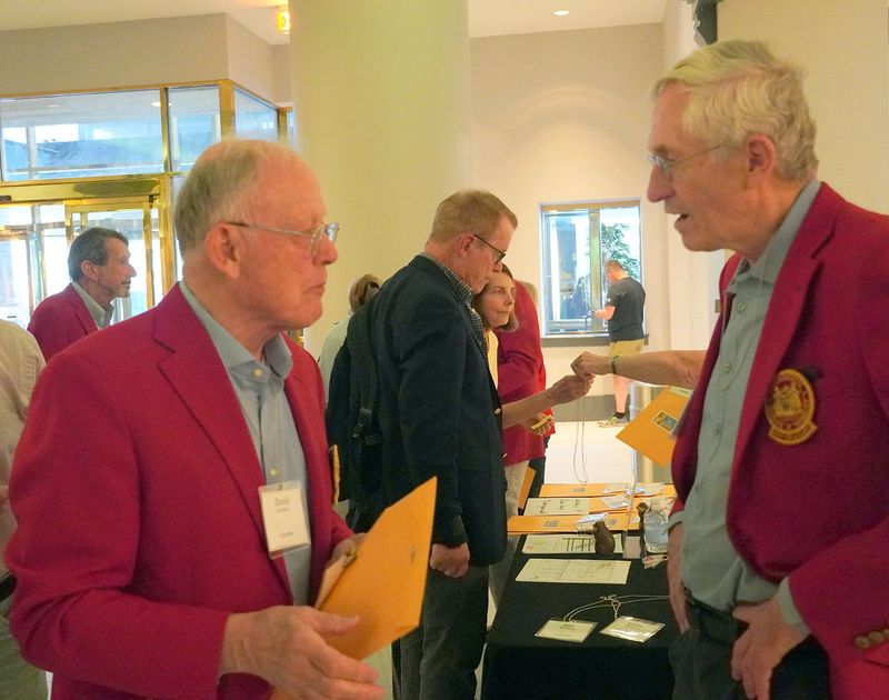 Dennis Womack-Kalla (Philly 2025 Reunion Chair) greets Dave Sanders '67 while Jim Foster '67 & wife check in in background