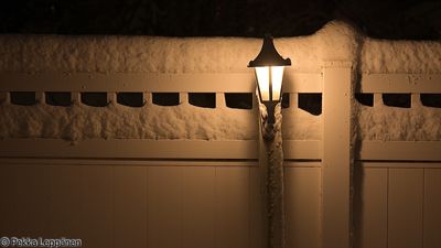 Fence on a winter night