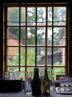Wine bottles filled with drinking water window