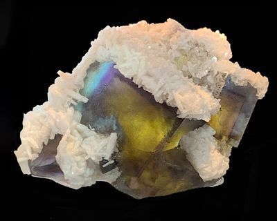 Fluorite partially covered with Barite crystals.