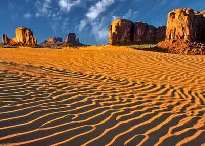 Sand dunes and buttes, Monument Valley, AZ