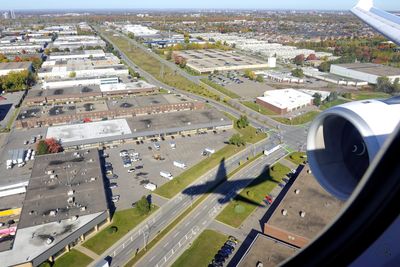Flying over the intersection of Poirier Blvd and Boulevard Thimens, Montréal