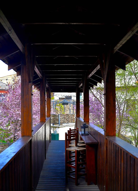 A charming, inviting place to read a book having a drink...