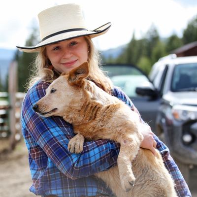 A cowgirl and her dog